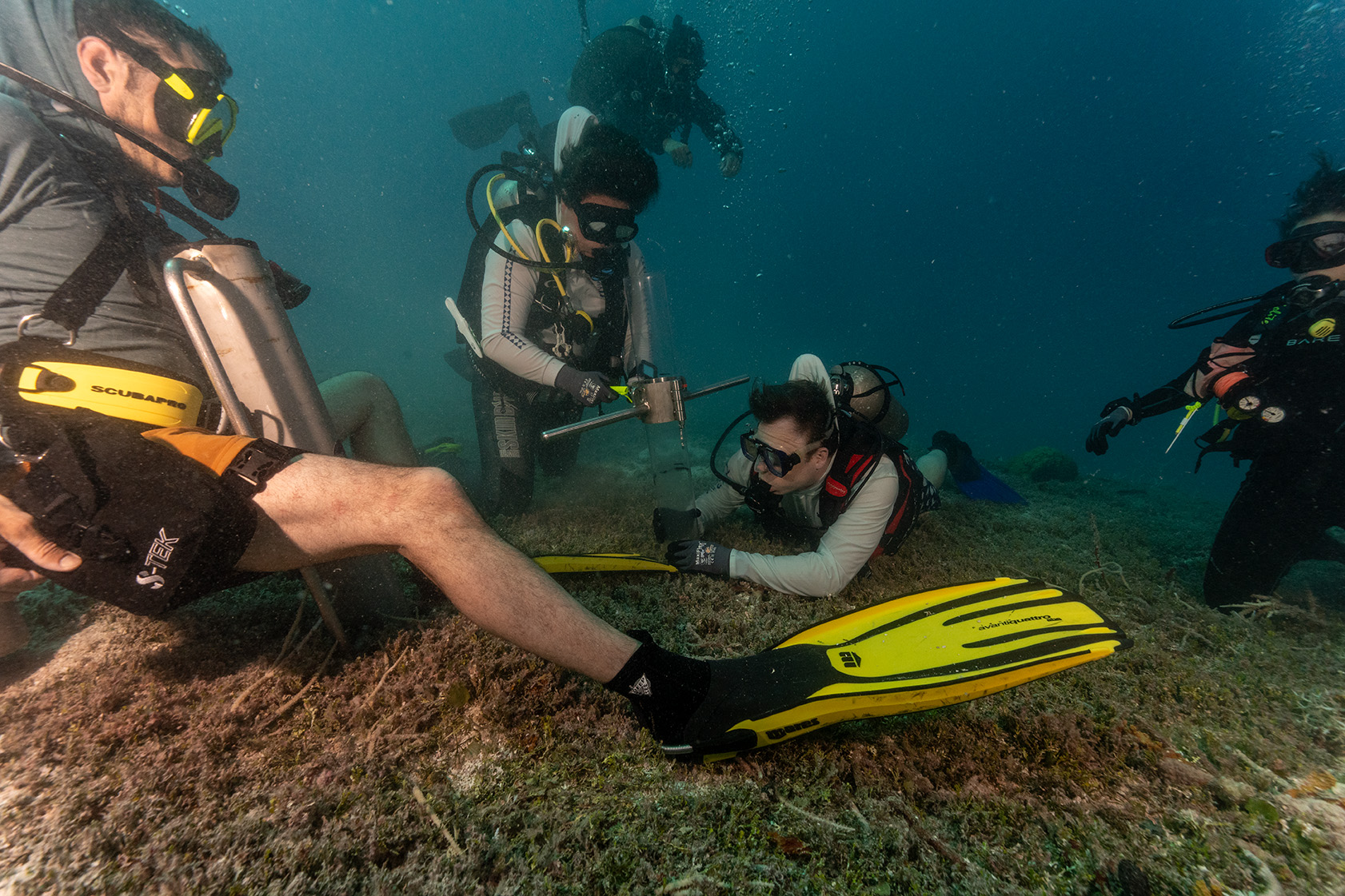 Divers taking a core sample from the seabed at Bikini Atoll