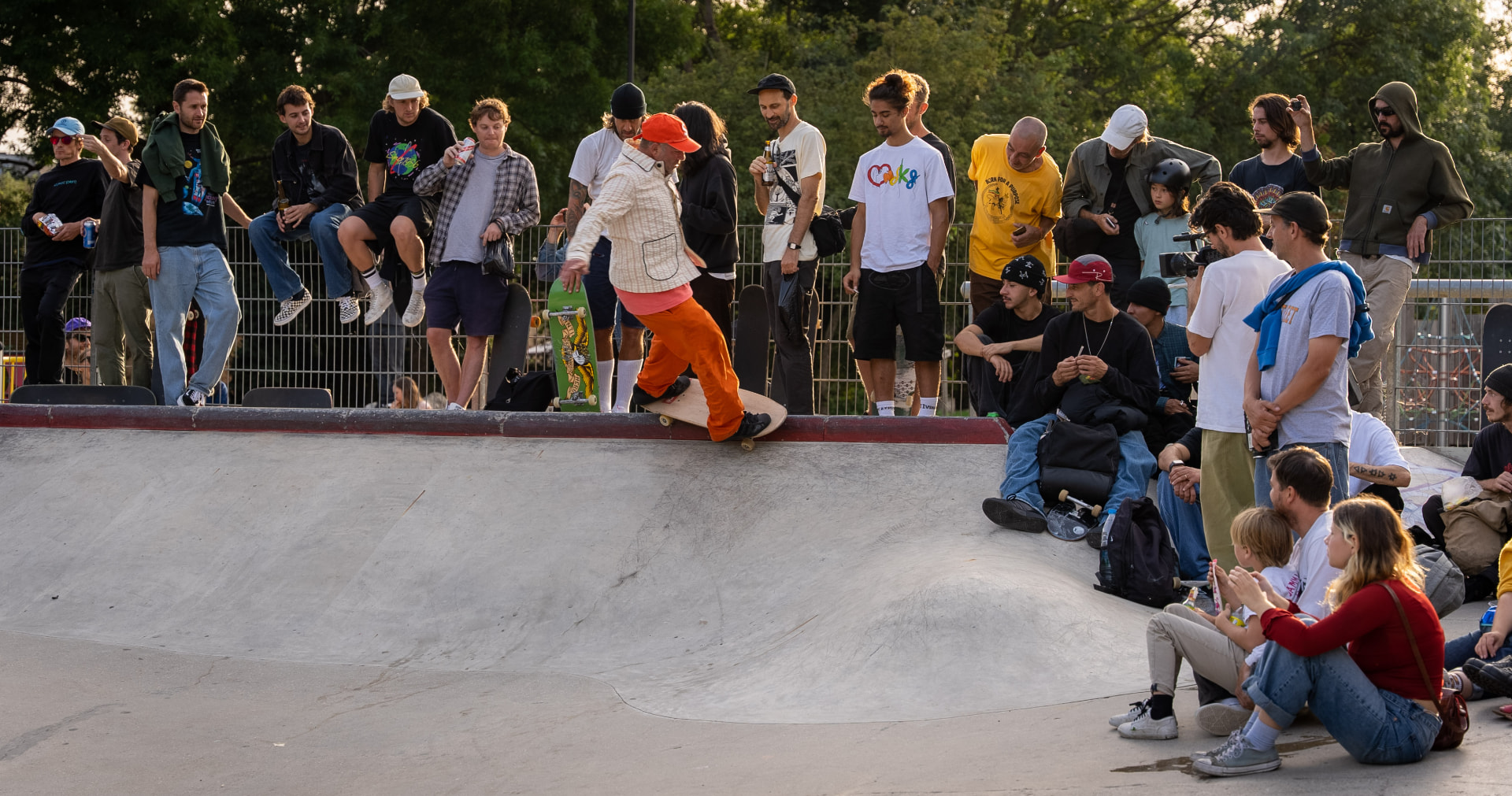 Mark Gonzales carving at the coping as a packed crowd watches from the deck
