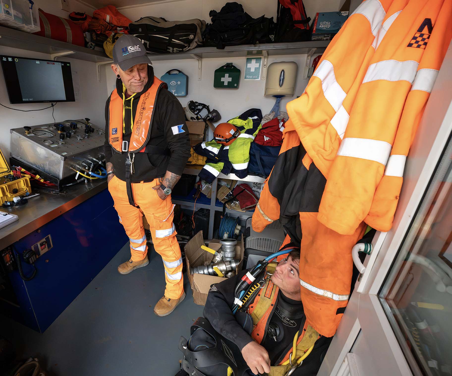 Crew and diving equipment inside the vessel's working cabin