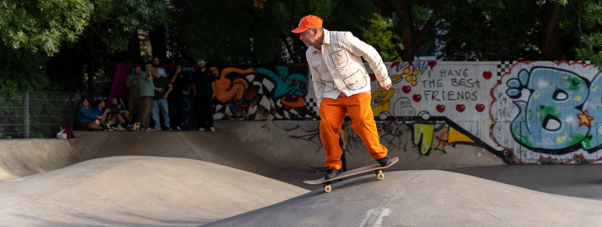 Mark Gonzales carving past a graffiti wall reading I have the best friends