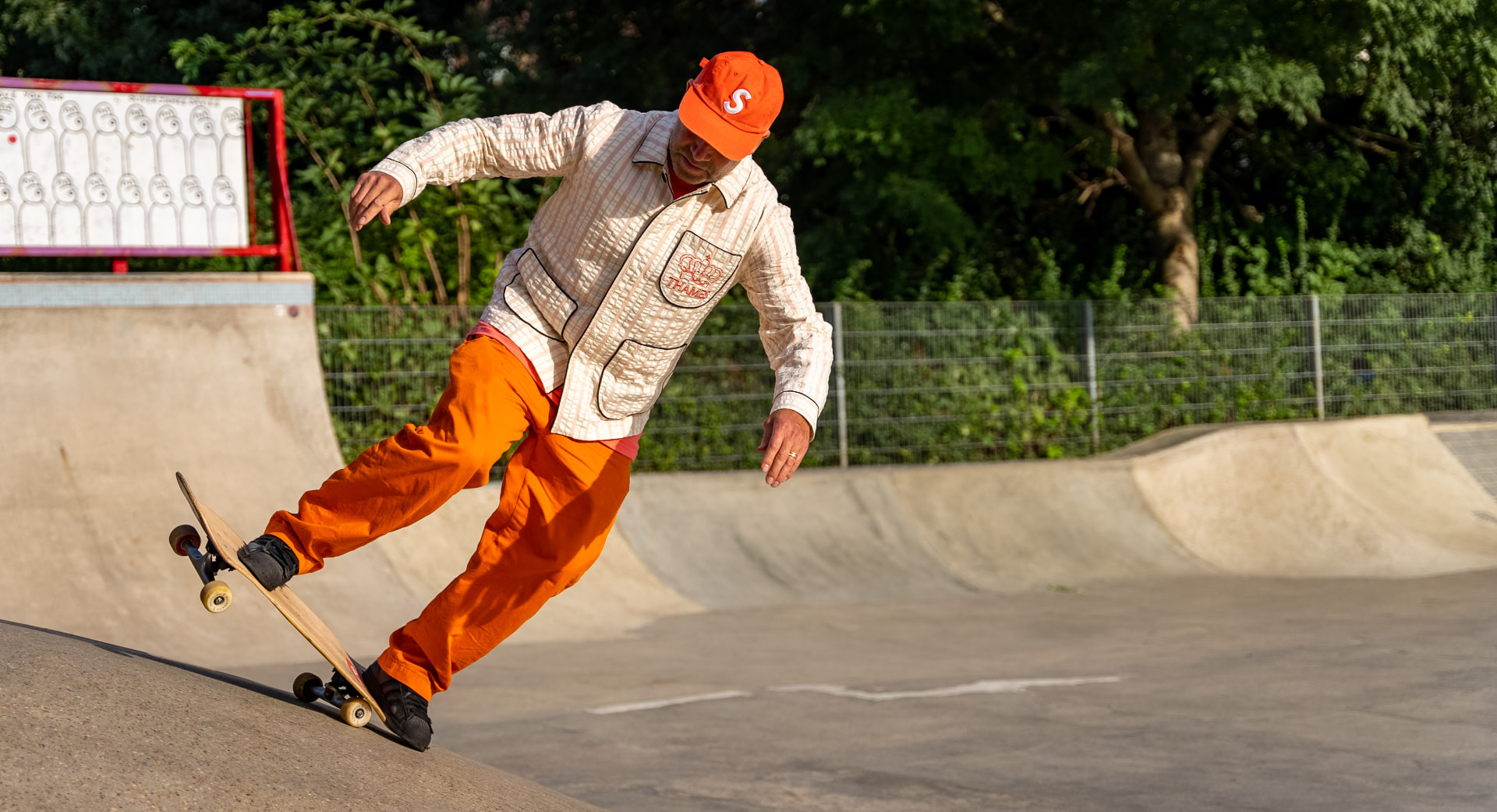 Mark Gonzales leaning into a hard carve on the bank in the last of the light