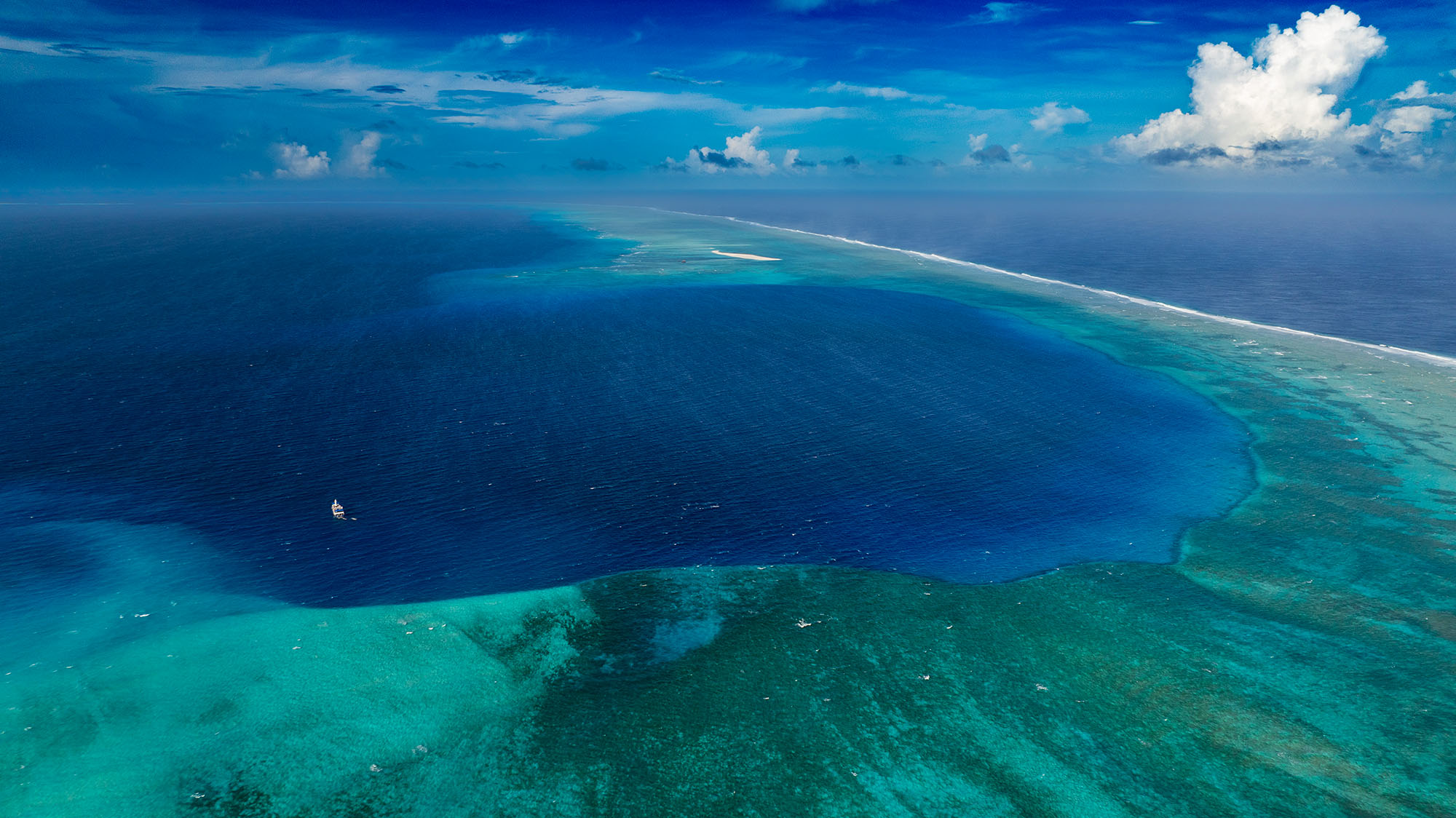 Aerial view of the Castle Bravo crater and reef edge at Bikini Atoll